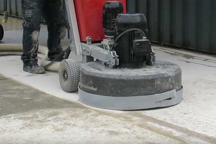 Concrete grinding for smooth floors and better adhesion. 